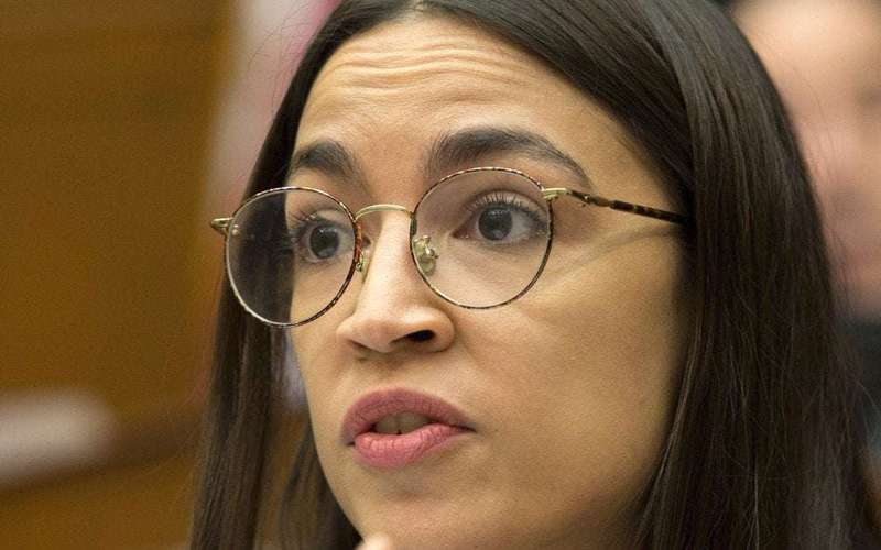 image for AOC says people who think raising minimum wage is a ‘crazy, socialist agenda' are living in a 'dystopian capitalist nightmare'