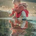 image for Took a pic of my daughter playing in a puddle and it makes me happy.