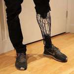 image for A wireframe prosthetic leg.