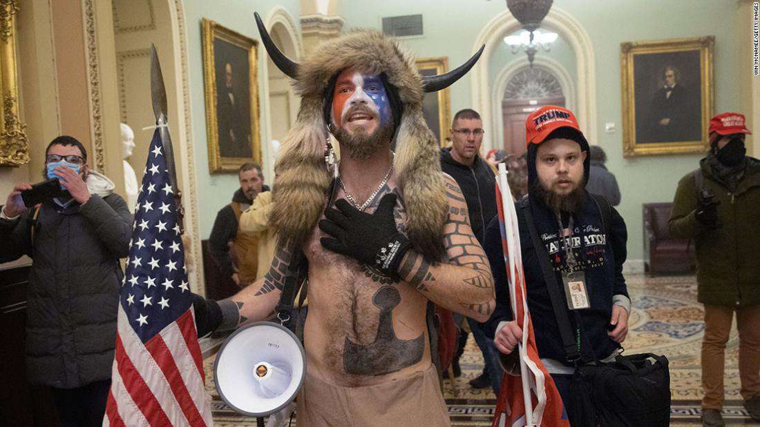 image for 'QAnon shaman' must remain in jail, judge rules