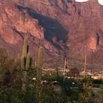 image for The shadow of a cougar catching its prey in the superstition mountains. Only showing for a few days a year.