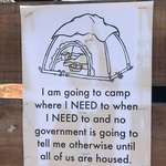 image for Sign posted near homeless encampment