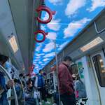 image for This subway train has clouds on the ceiling to look like the sky