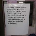 image for A sign outside a pet store disallowing the sale of bunnies until after Easter