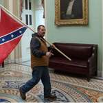 image for Kevin Seefried who carried Confederate flag to Capitol during Jan 6 riot indicted