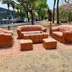 image for This sofa set made out of red bricks.