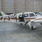 image for The Piper Seminole at my flying school was neatly filleted by a plane that had run away from its owner after being hand started circa 2001.