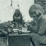 image for Little girl having a tea party with a lobster and a hawk in 1938.