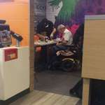image for McDonald's employee closes register, cuts up food and feeds it to disabled man. Other workers ignored his request for help.