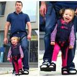 image for Father invents tandem walking harness so his disabled daughter can have the sensation of walking