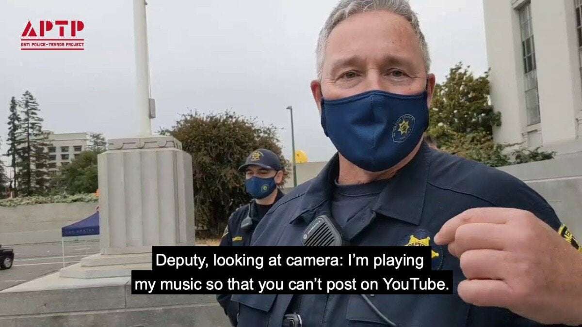 image for Cops are playing music during filmed encounters to game YouTube's copyright striking
