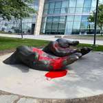 image for Someone put red paint on the "Serve and Protect" sculpture at the Salt Lake City police building