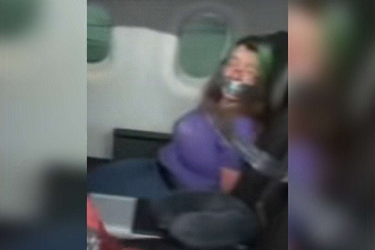 image for Video shows woman taped to seat after trying to open plane door on American Airlines flight – .