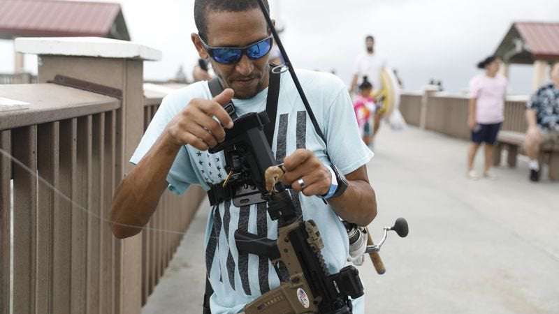 image for He walked Clearwater Beach with an AR-15. Is he a menace or a martyr?