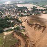 image for A flooded and eroding quarry has swallowed houses Erftstadt, Germany. Multiple people missing