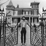 image for Stephen King standing at the gate of his house in Bangor, Maine. 1982