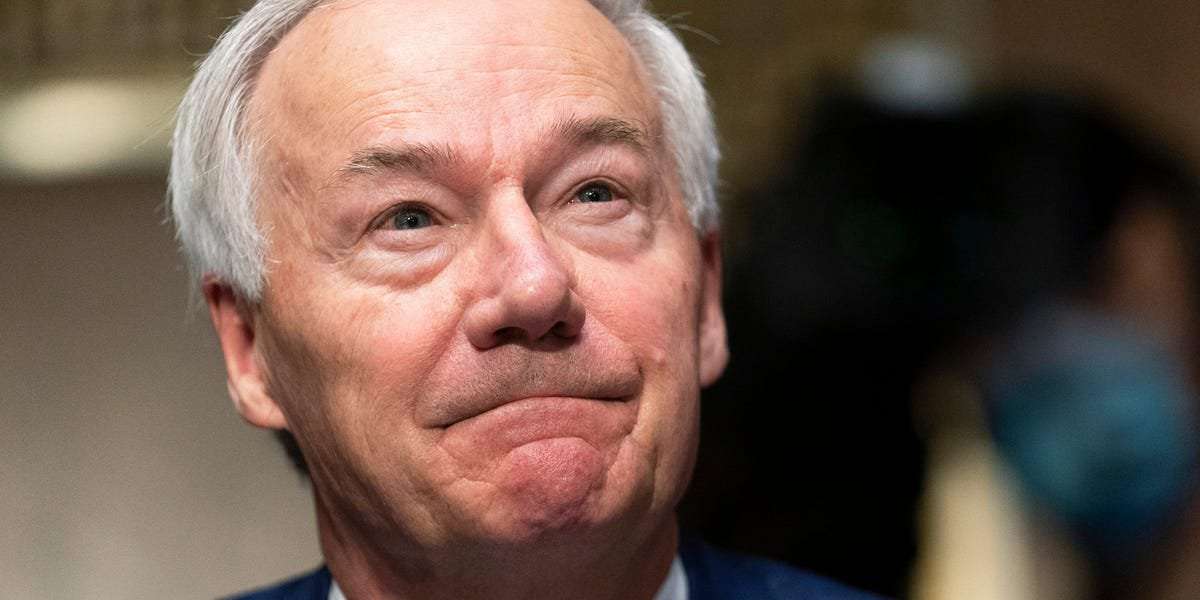 image for Arkansas GOP governor who is holding town halls to urge vaccinations said people he meets have called the shot a 'bioweapon' and talked about 'mind control'