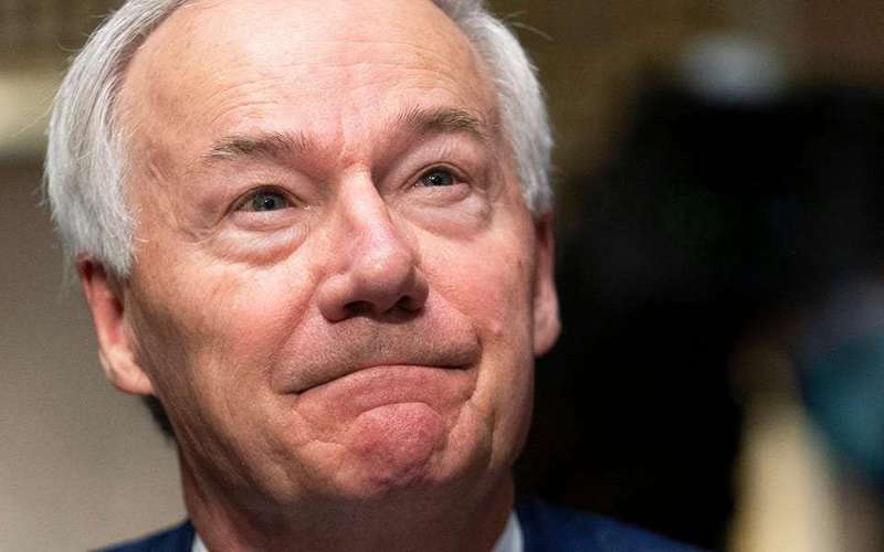image for Arkansas GOP governor who is holding town halls to urge vaccinations said people he meets have called the shot a 'bioweapon' and talked about 'mind control'