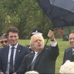 image for The prime minister of my country failing to open an umbrella this morning