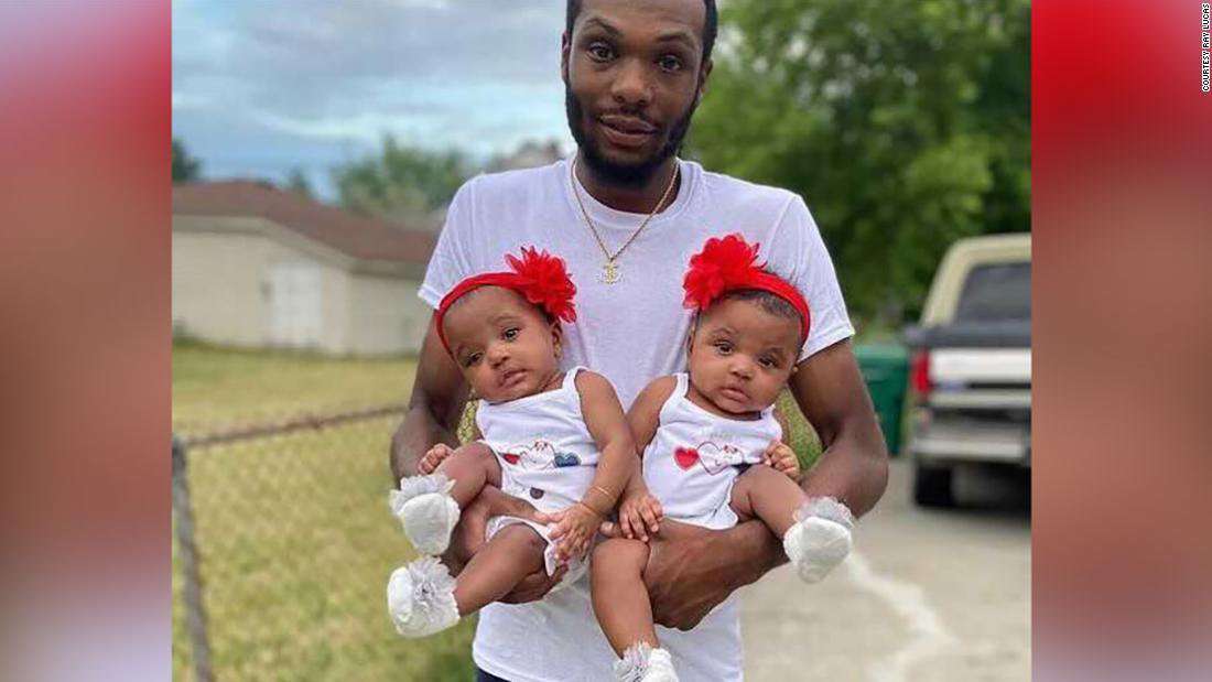 image for Michigan father rushed into burning home to save his twin 18-month-old daughters
