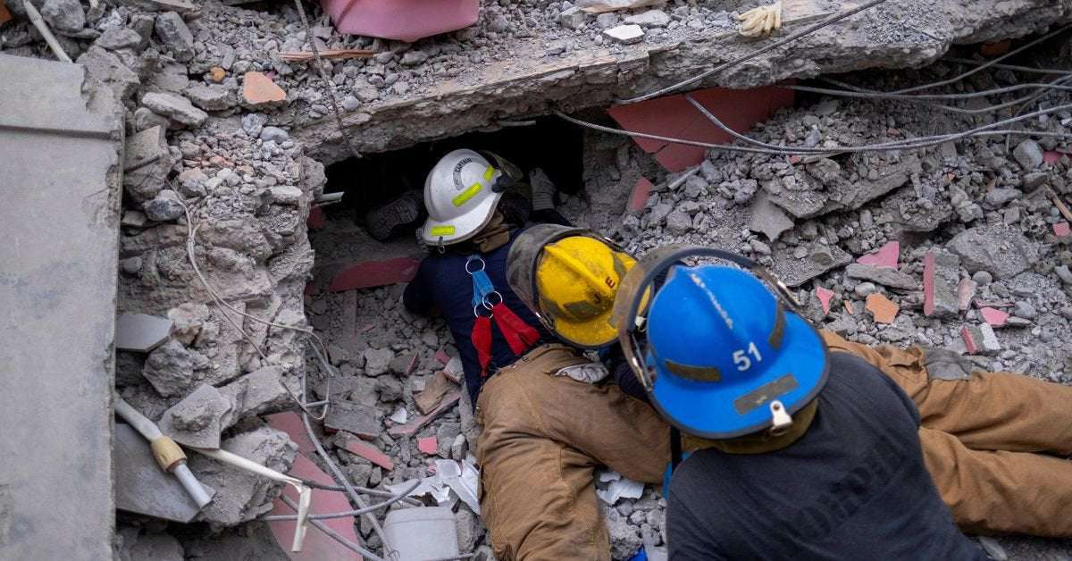 image for Sixteen people found alive, 9 dead from building that once housed UN