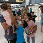 image for A family from Afghanistan arrives at Dulles International Airport in Chantilly, Virginia