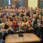 image for Evil Texas legislators smiling as they sign law to take away rights
