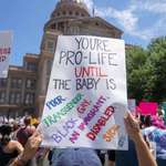 image for Sign at a pacific protest against the ban on abortion in Texas