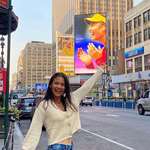 image for Emma Raducanu seeing herself on a billboard in New York City.