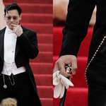 image for Johnny Depp wearing a gold coin from Pirates of the Caribbean at the Met Gala