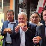 image for Bolsonaro, the unvaccinated president of Brazil eating pizza on the street of New York