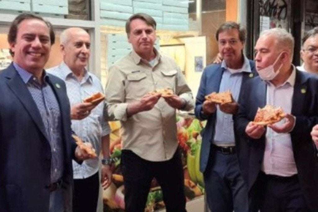 image for Brazil’s unvaccinated president had to eat pizza on NYC sidewalk