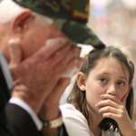 image for Granddaughter watching her grandfather break into tears at her school's Veterans Day Assembly