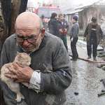 image for 83 Year Old Man Hugs Cat After Tragic House Fire
