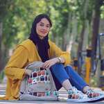 image for An Iranian girl whose shoes match her backpack