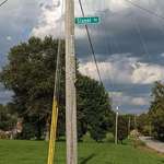 image for This street sign has been stolen a countless number of times. It keeps getting higher, literally.