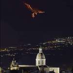 image for Eruption on Mt Etna (Sicily) at night looks like a Phoenix flying through the sky.