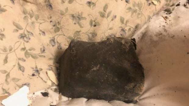 image for Woman rocked awake by meteorite chunk crashing into her bedroom