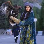 image for Just a girl with a golden eagle. Kazakhstan.