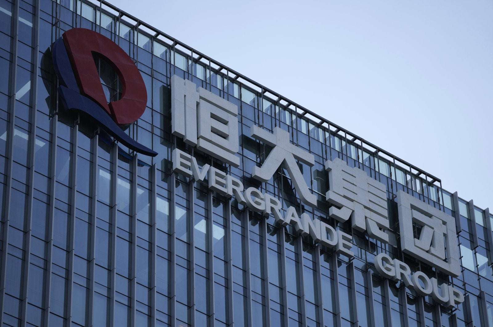 image for China Evergrande again averts default but debt woes mount