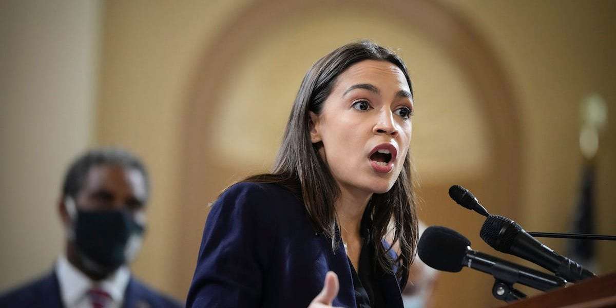 image for AOC calls out the 'enormous' amount of executive power Biden could have on student debt, climate change, and immigration while she's watching him 'hand the pen to Joe Manchin and Kyrsten Sinema'