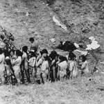 image for Naked Jewish women, some of whom are holding children, await their turn to be executed by Nazis