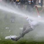 image for Man protesting Covid restrictions in Belgium hit by water cannon