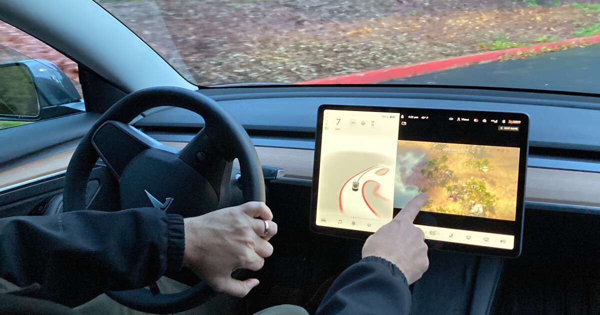 image for U.S. opens formal investigation into Tesla letting drivers play video games