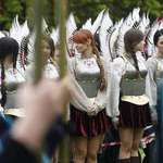 image for Polish women dressed like the winged hussars in a national festival