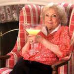 image for Tonight, celebrate like Betty White; drinking vodka and eating hotdogs.