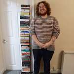 image for I read 71 books in 2021, here is a photo next to all of them, I am 5'9" for reference