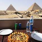 image for Pyramids of Giza as seen from a nearby Pizza Hut a quarter mile away.