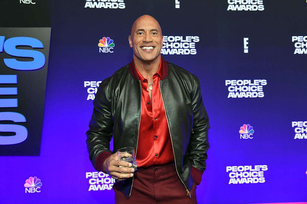 image for Dwayne Johnson says he's coming to 'Sesame Street' to 'kick a** and eat cookies' in an epic smackdown with Cookie Monster