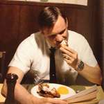 image for Neil Armstrong eating his last breakfast on Earth before leaving for the moon in 1969.